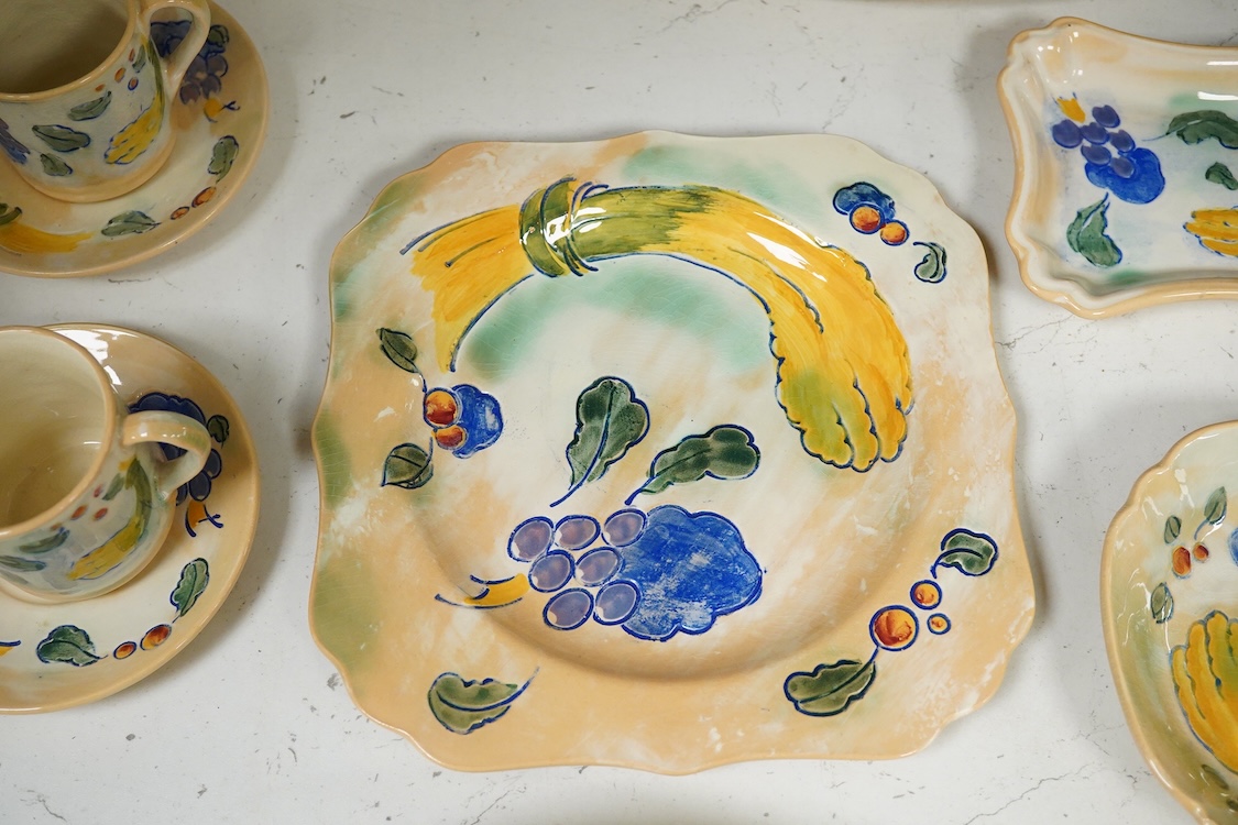 A collection of Doulton Brangwynware to include an oval dish, wall plate and two coffee cans and saucers, largest 32cm in diameter